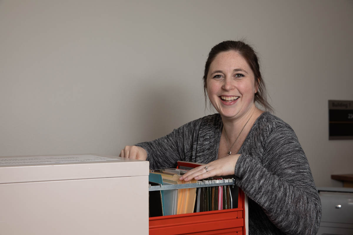 Woman at a filing cabinet